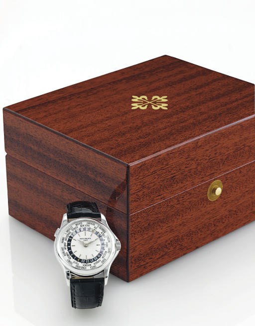 PATEK PHILIPPE.  A FINE 18K WHITE GOLD AUTOMATIC WORLD TIME WRISTWATCH
