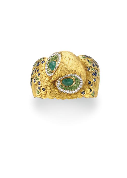 A MULTI-GEM AND GOLD OWL BRACELET