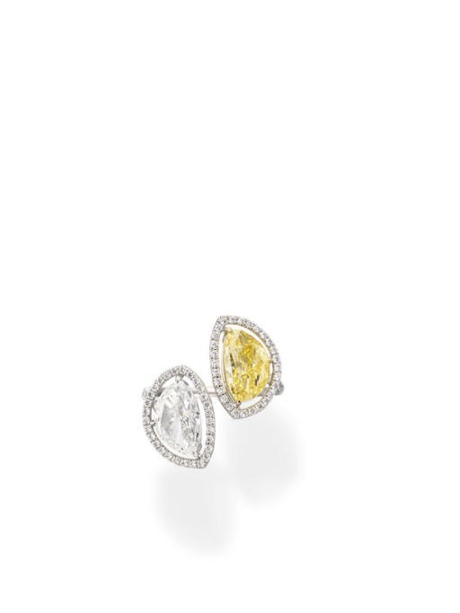 A TWO-STONE COLORED DIAMOND AND DIAMOND RING
