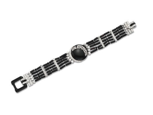 AN AMUSING ART DECO ONYX AND DIAMOND BRACELET, BY CARTIER