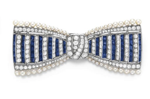 AN ART DECO DIAMOND, SAPPHIRE AND PEARL BOW BROOCH, BY TIFFANY & CO.