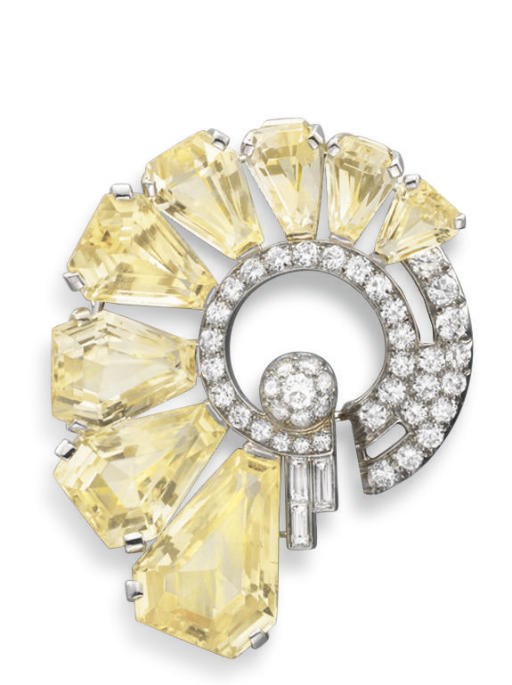 A YELLOW SAPPHIRE AND DIAMOND BROOCH, BY OSCAR HEYMAN & BROTHERS
