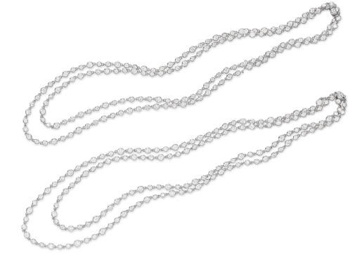 A PAIR OF DIAMOND LONGCHAIN NECKLACES