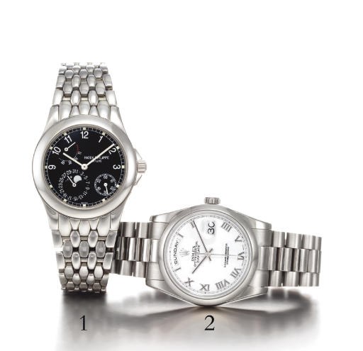 ROLEX. AN 18K WHITE GOLD AUTOMATIC WRISTWATCH WITH CENTRE SECONDS, DAY, DATE AND BRACELET