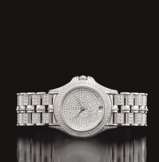 MAUBOUSSIN. AN IMPRESSIVE 18K WHITE GOLD AND DIAMOND-SET AUTOMATIC WRISTWATCH WITH CENTRE SECONDS, DATE AND BRACELET