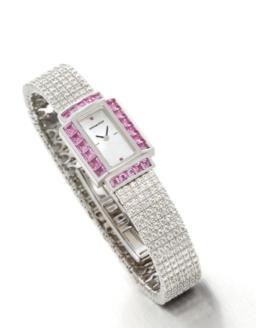 AUDEMARS PIGUET. A LADY'S 18K WHITE GOLD, DIAMOND AND PINK SAPPHIRE-SET RECTANGULAR WRISTWATCH WITH BRACELET AND MOTHER-OF-PEARL DIAL
