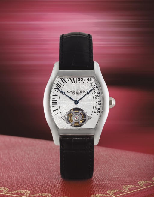 CARTIER. A VERY RARE LIMITED EDITION PLATINUM TONNEAU-SHAPED DOUBLE RETROGRADE TOURBILLON WRISTWATCH