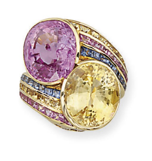 A MULTI-COLOURED SAPPHIRE CROSSOVER RING