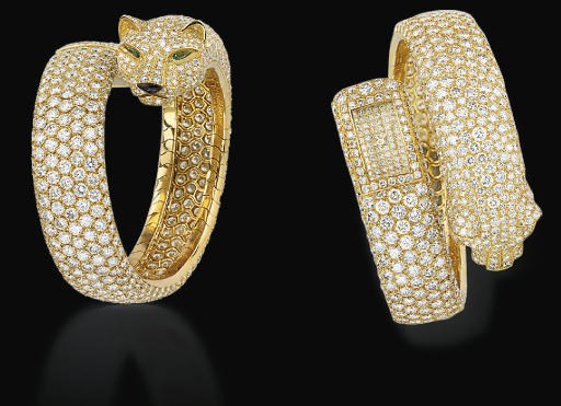 A LADY'S DIAMOND PANTHER BANGLE WATCH, BY CARTIER