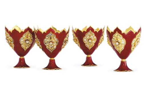 A RARE SET OF FOUR SWISS GOLD, ENAMEL AND GEM-SET ZARFS
