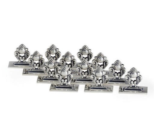 A SET OF TWELVE DANISH SILVER PLACECARD HOLDERS DESIGNED BY JOHAN ROHDE