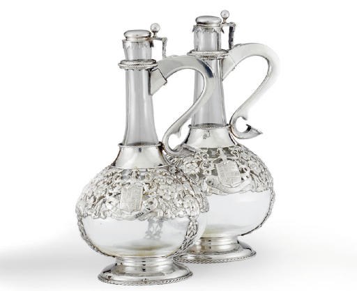 A PAIR OF FRENCH SILVER-MOUNTED GLASS CLARET JUGS