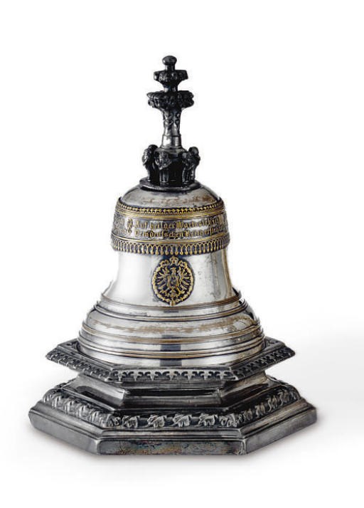 A GERMAN SILVER AND GOLD-PLATED TABLE BELL OF HISTORICAL INTEREST