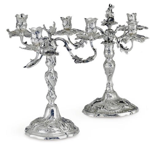 A MATCHED PAIR OF GERMAN SILVER THREE-LIGHT CANDELABRA