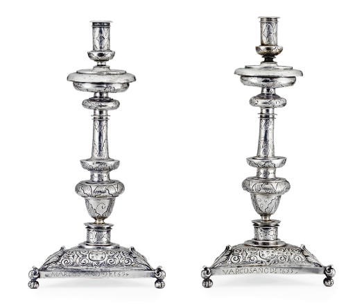 A PAIR OF SPANISH COLONIAL SILVER ALTAR CANDLESTICKS