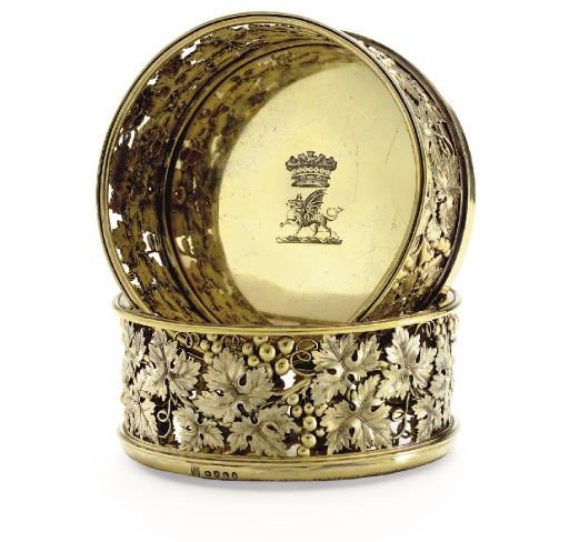 TWO GEORGE III SILVER-GILT WINE COASTERS
