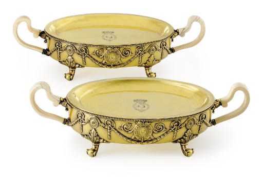 A FINE PAIR OF GEORGE IV SILVER-GILT WARMING DISHES**