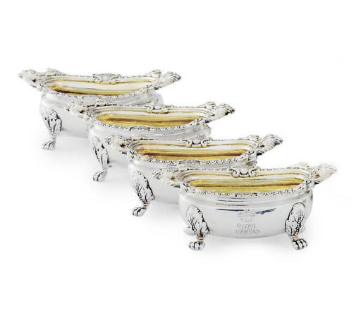 A SET OF FOUR GEORGE III/GEORGE IV SILVER SALT CELLARS AND SPOONS