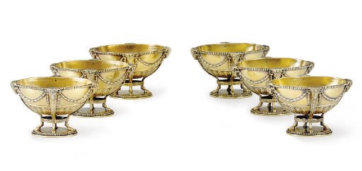 A SET OF SIX GEORGE III SILVER-GILT SALT CELLARS