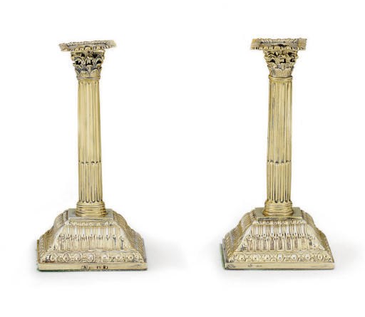 A PAIR OF GEORGE III SILVER-GILT SMALL CANDLESTICKS