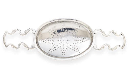 A GEORGE III SCOTTISH SILVER PUNCH STRAINER