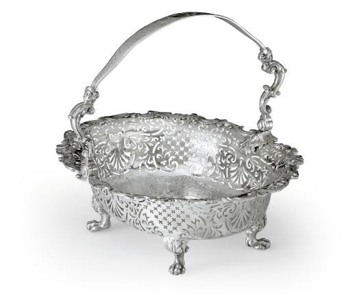 A GEORGE II IRISH SILVER CAKE BASKET