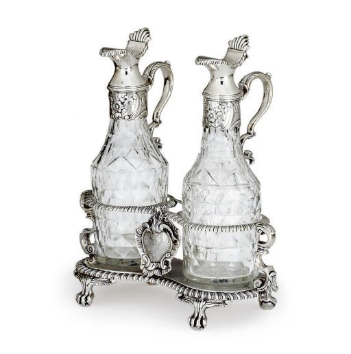 A REGENCY SILVER CRUET STAND WITH GLASS BOTTLES