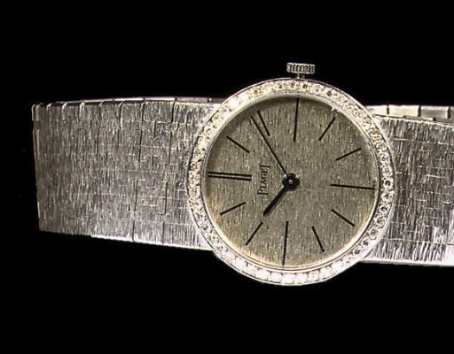 AN 18K WHITE GOLD AND DIAMOND WRISTWATCH, BY PIAGET