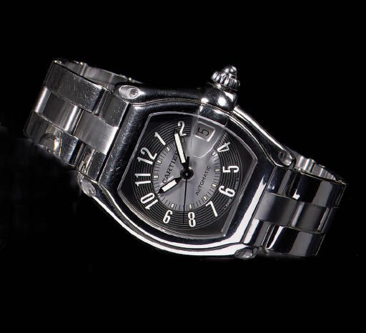 A STAINLESS STEEL TONNEAU-SHAPED AUTOMATIC WRISTWATCH WITH SWEEP CENTRE SECONDS AND DATE, BY CARTIER