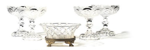 A SET OF FOUR FROSTED AND CUT GLASS FOOTED BOWLS AND A BASKET