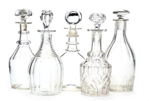 FIVE CLEAR GLASS DECANTERS AND STOPPERS