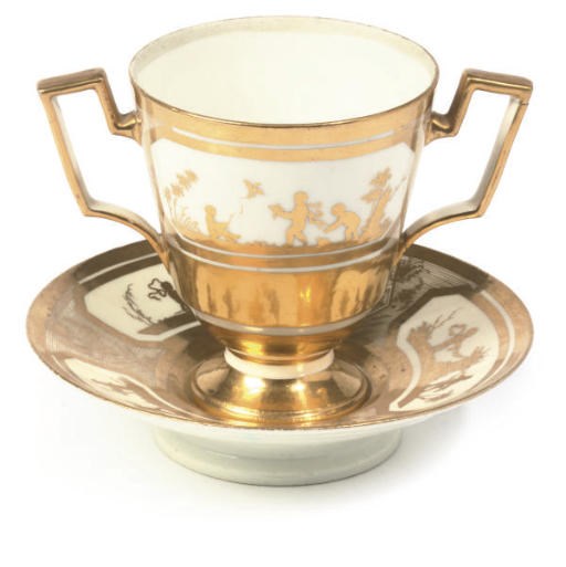 A PARIS (LA COURTILLE) PORCELAIN GILT-GROUND CHOCOLATE CUP AND STAND
