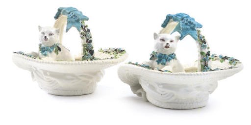 TWO ENGLISH PORCELAIN MODELS OF CATS IN BASKETS