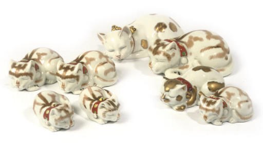 A GROUP OF EIGHT JAPANESE KUTANI PORCELAIN CATS