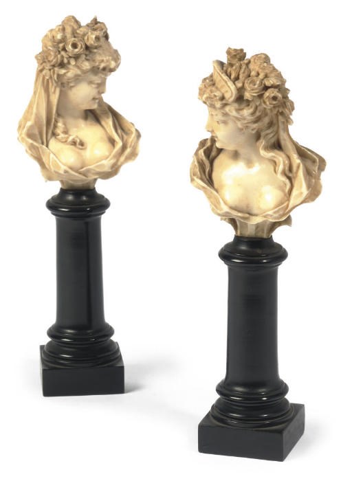 A PAIR OF FRENCH CARVED IVORY FEMALE BUSTS