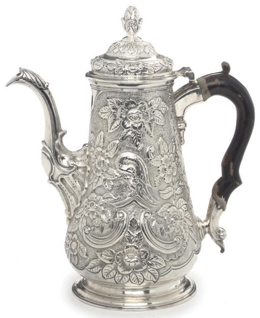 A GEORGE III SCOTTISH LATER CHASED SILVER COFFEE POT