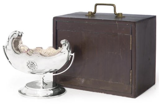 A SILVER NOVELTY CRIB, WITH BISQUE HEAD INFANT DOLL