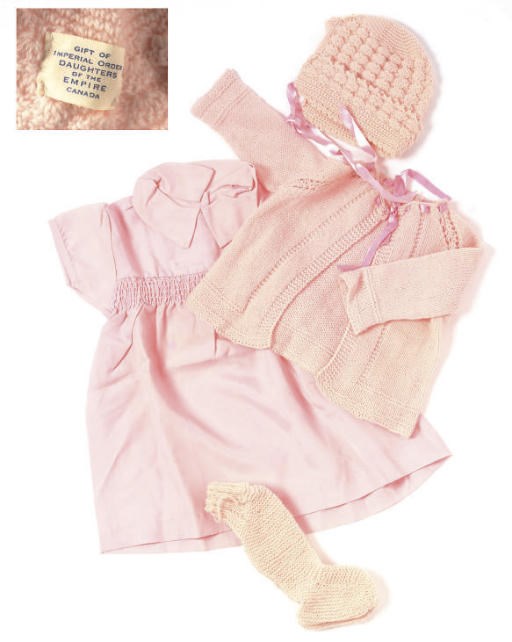 A COLLECTION OF PINK BABY CLOTHES