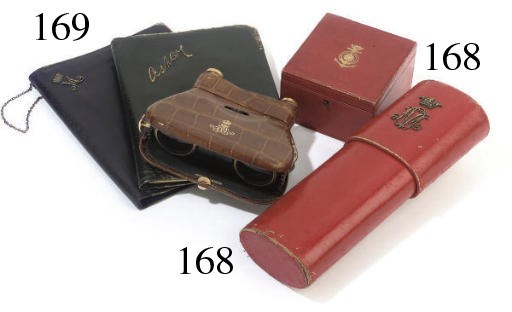 QUEEN MARY'S OPERA GLASSES
A PAIR OF GILT-BRASS MOUNTED AND CROCODILE LEATHER 'LA MIGNIONNE' OPERA GLASSES