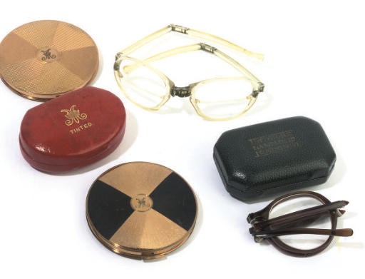 PRINCESS MARY'S COMPACTS AND SPECTACLES
TWO GILT-METAL COMPACTS AND TWO PAIRS OF SPECTACLES