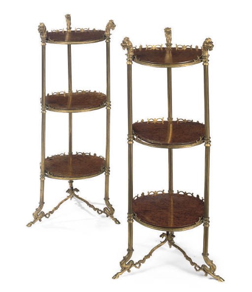 A PAIR OF GILT-METAL AND AMBOYNA THREE TIER CIRCULAR ÉTAGÈRES