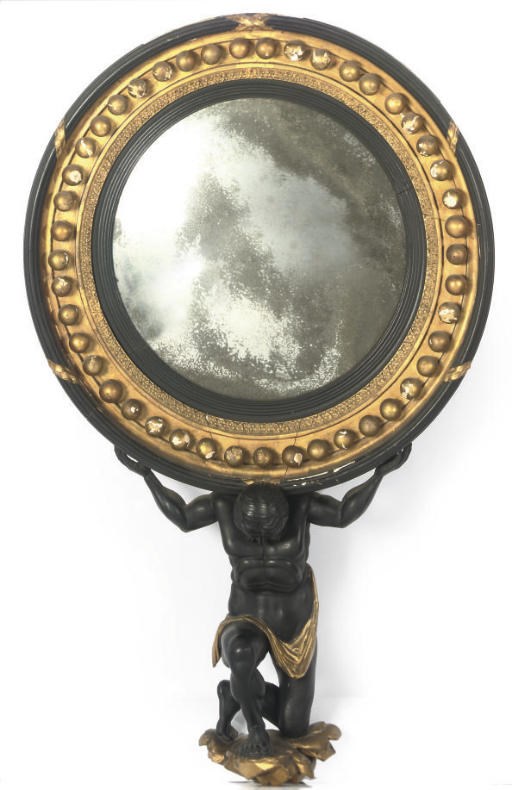 A REGENCY PARCEL-GILT AND EBONISED CONVEX MIRROR