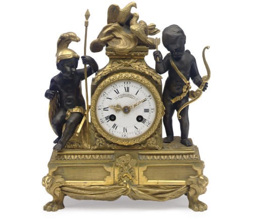A FRENCH ORMOLU AND PARCEL-GILT BRONZE MANTEL CLOCK