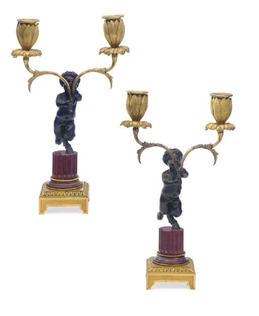 A PAIR OF LOUIS XVI STYLE ORMOLU, PATINATED BRONZE AND ROUGE MARBLE TWIN-LIGHT CANDELABRA