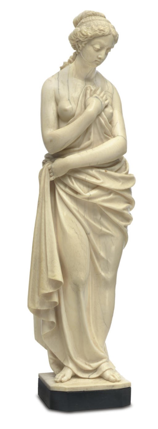 A FRENCH IVORY FIGURE OF A SCANTILY-CLAD MAIDEN**