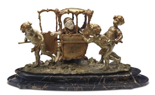 A FRENCH BRONZE AND IVORY GROUP OF FOUR PUTTI WITH A SEDAN CHAIR**