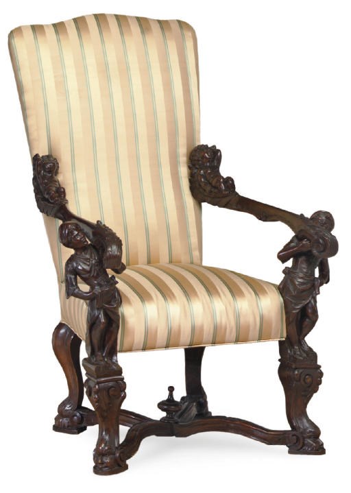 AN ITALIAN CARVED WALNUT ARMCHAIR