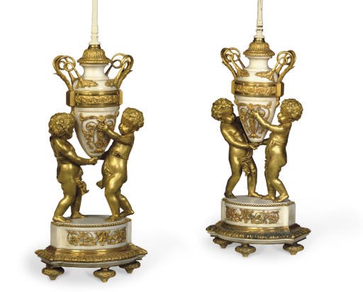 A PAIR OF NAPOLEON III ORMOLU AND WHITE MARBLE FIGURAL LAMPS
