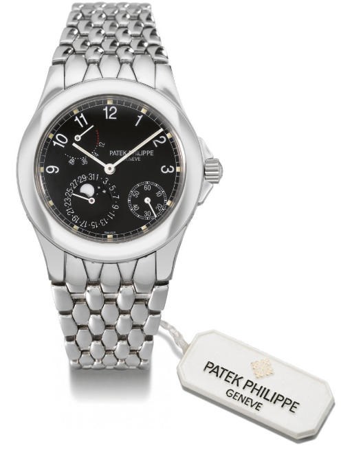 Patek Philippe. A fine stainless steel self-winding water-resistant wristwatch with date, phases of the moon, up and down indicator and bracelet