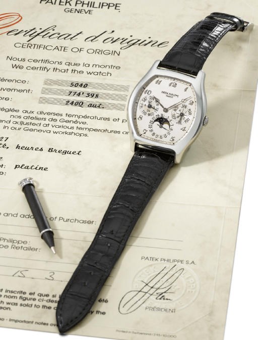 Patek Philippe. A fine platinum self-winding tonneau-shaped perpetual calendar wristwatch with phases of the moon